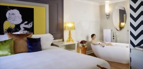 Guest relaxing in our Rolling Stones inspired, King bedded room.